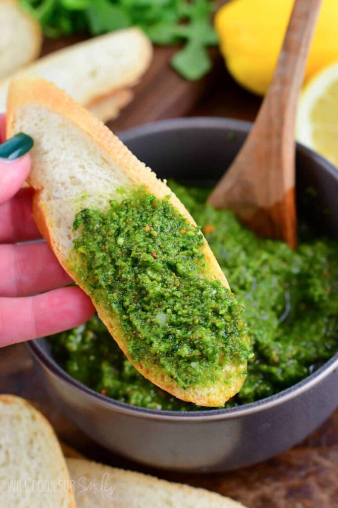 spread pistachio pesto on crackers or slices of crusty bread